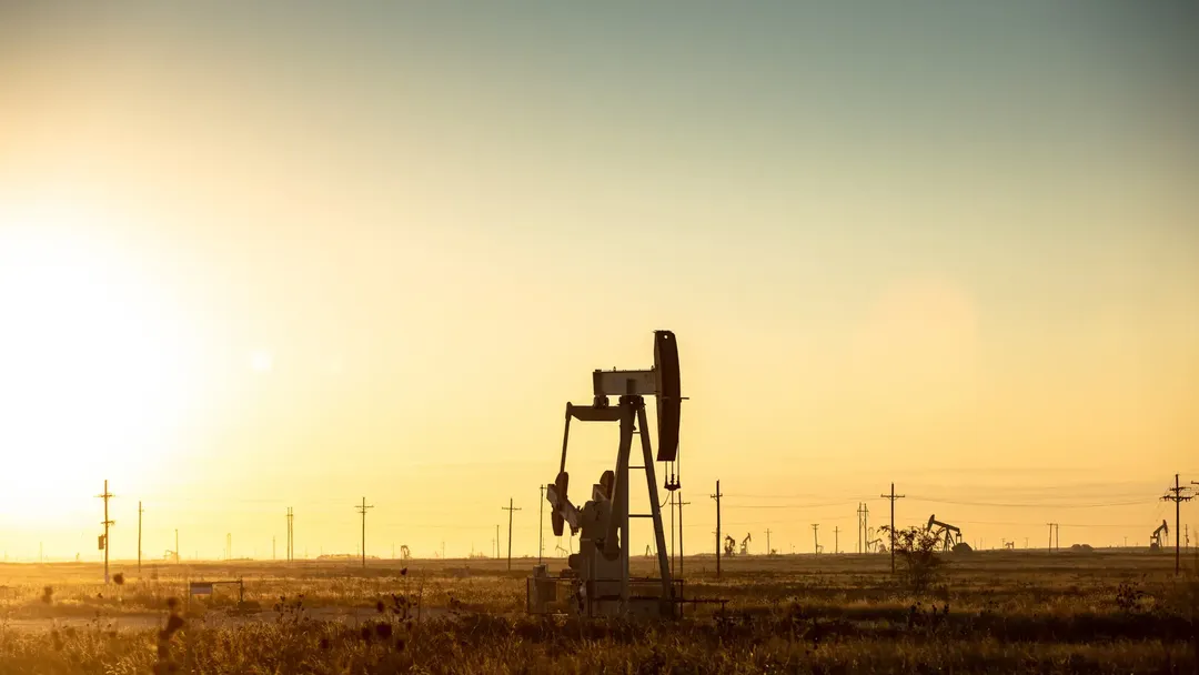 oil-pumpjack-in-a-field-at-sunset